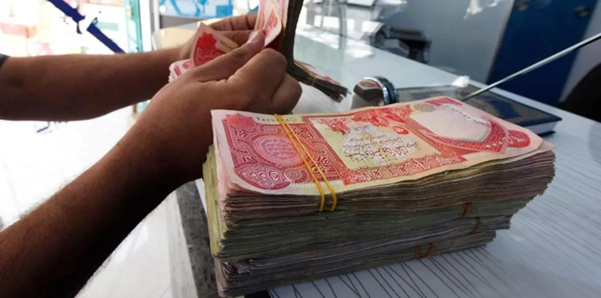 العراق يخفض إنفاق 2016 ويستدين مليارات الدولارات