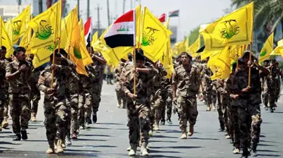 عناصر يتبعون فصائل عراقية مسلحة